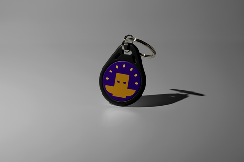 Our purple keychain Totem with a yellow logo on a gray background. Used to aid focus for ADHD and students. Totem Focus.